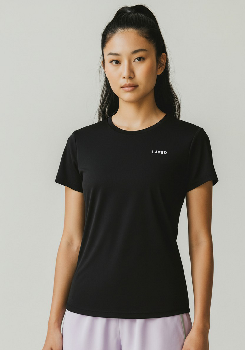 Close-up front view of black Layer FTR Graphic Running Tee showing lightweight performance fabric and fit.
