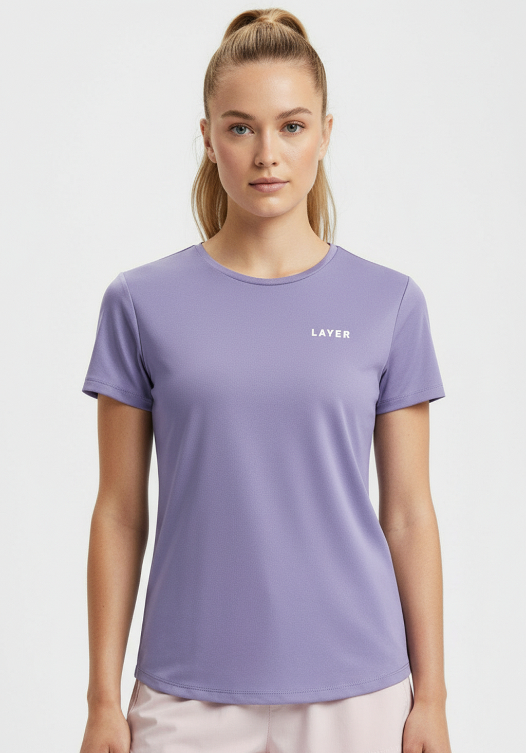Close-up of women’s lavender Layer FTR Graphic Run Tee showing crew neck and subtle Layer chest logo