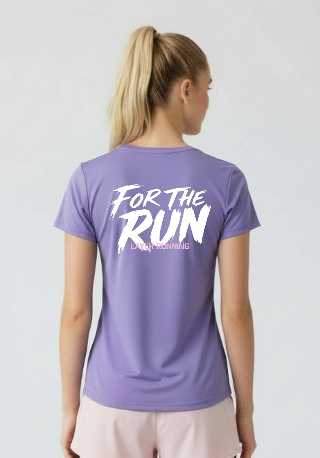 Straight back view of women’s lavender Layer FTR Graphic Run Tee with bold For The Run graphic