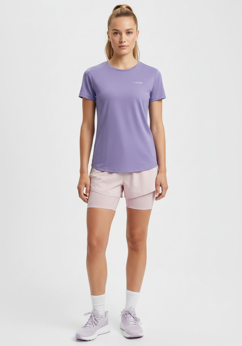 Front view of women’s lavender Layer FTR Graphic Run Tee showing short sleeve design and lightweight performance fabric