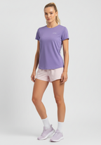 Women wearing lavender Layer FTR Graphic Run Tee with short sleeves and relaxed athletic fit, paired with light pink running shorts