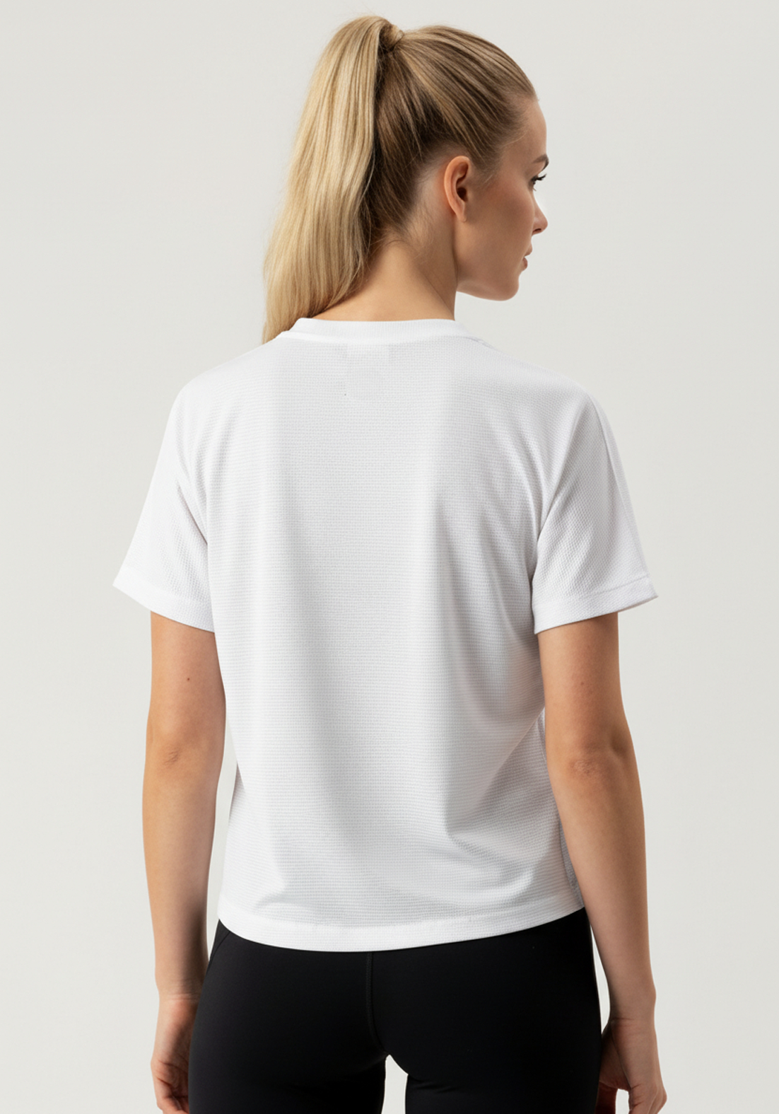 Layer Women's Vento running tee in white, back view
