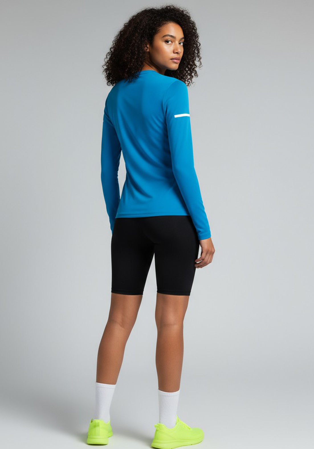 Layer Women’s For The Run Long Sleeve Tee in sapphire – on-model back view showing contoured fit and soft stretch fabric