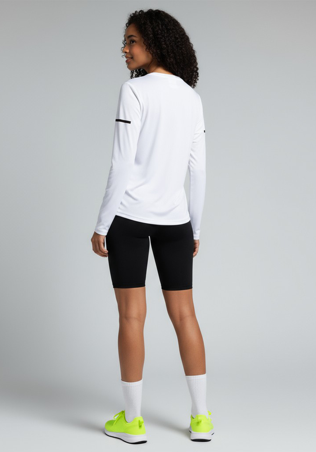 Layer Women’s For The Run Long Sleeve Tee in white – on-model back view showing lightweight technical fabric and tailored fit