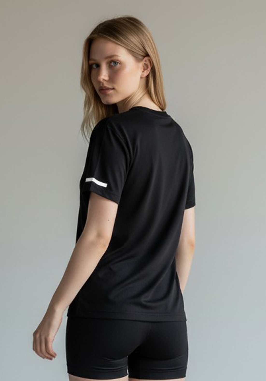 Layer Women’s For The Run Tee in black – close-up back view highlighting ergonomic seams and lightweight construction