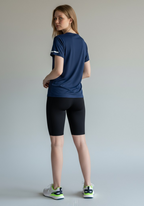 Layer Women’s For The Run Tee in navy – on-model back view showing relaxed athletic fit and subtle design detail