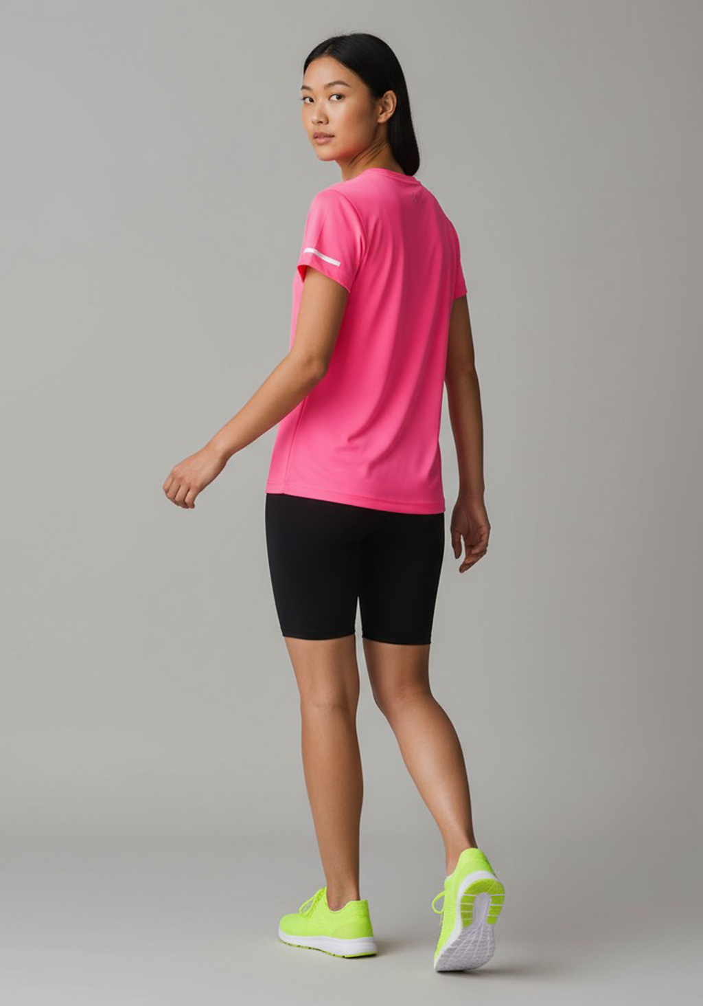Layer Women’s For The Run Tee in bright pink – on-model back view showing athletic fit and lightweight construction