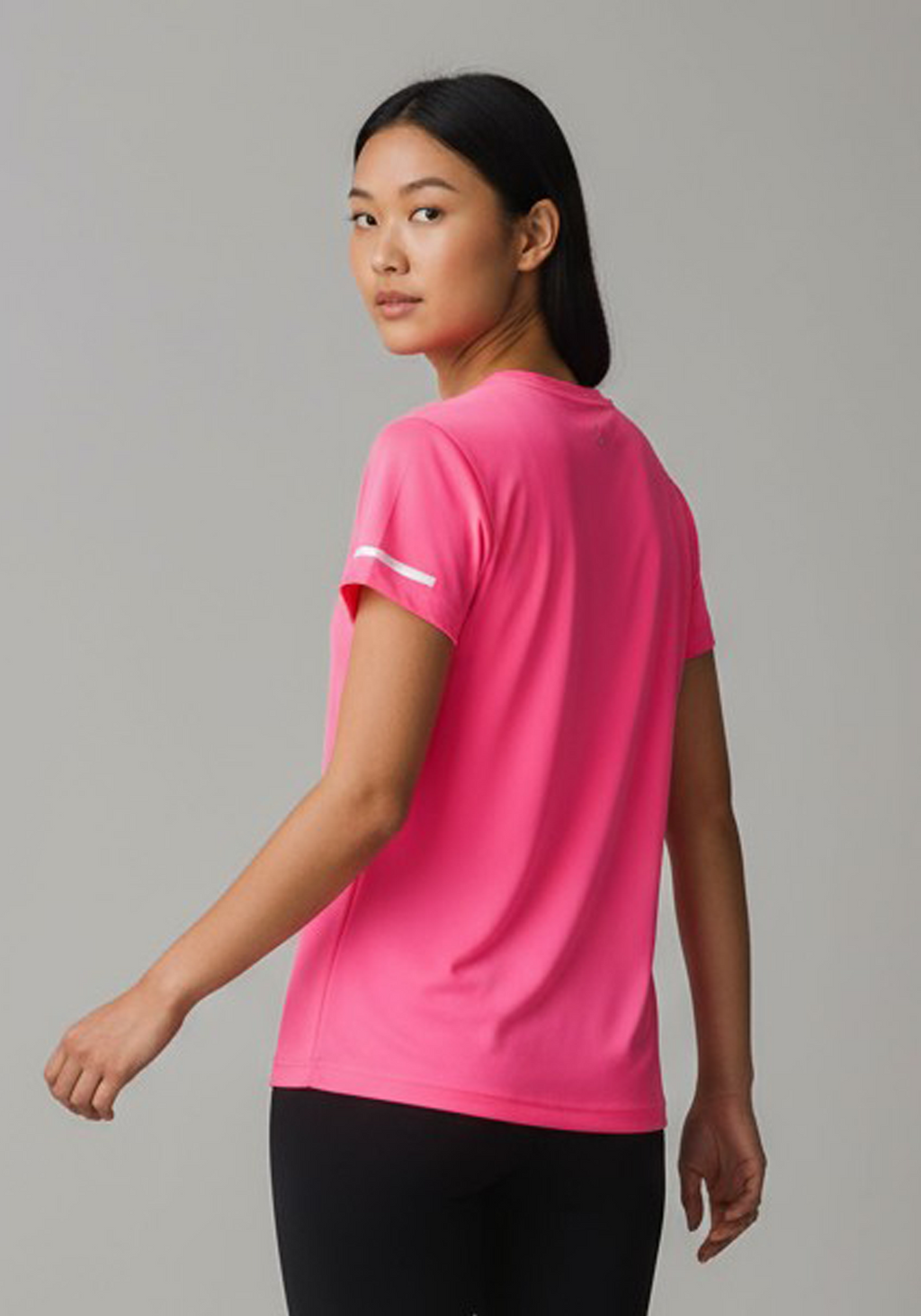 Layer Women’s For The Run Tee in bright pink – close-up back view highlighting smooth seams and flexible design